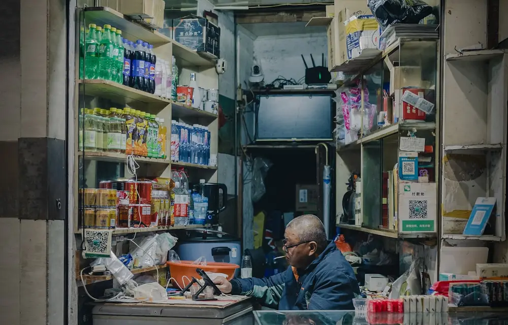 Two owners standing together in their own shop